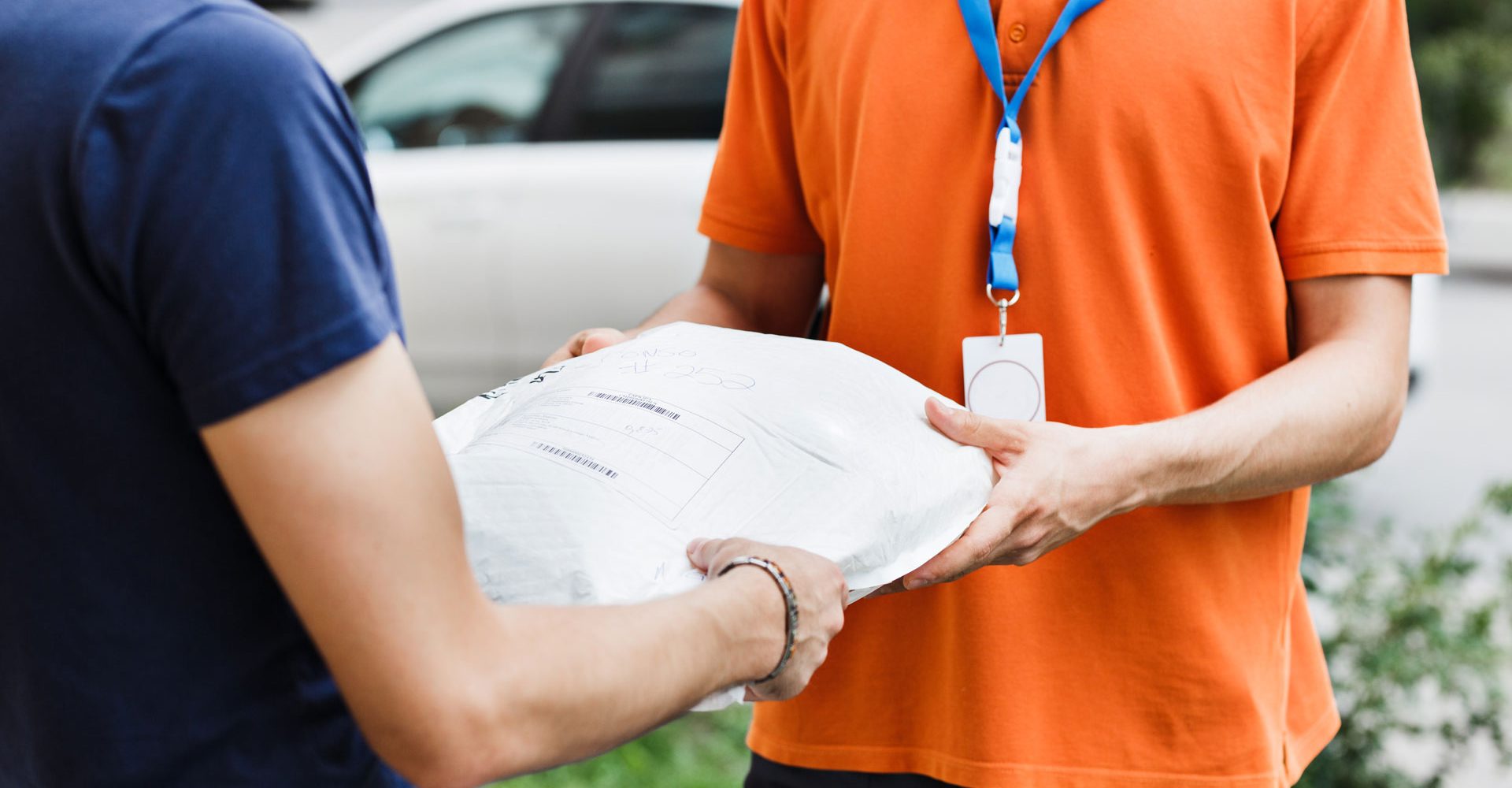 a-person-wearing-an-orange-t-shirt-and-a-name-tag-8FLENRM.jpg